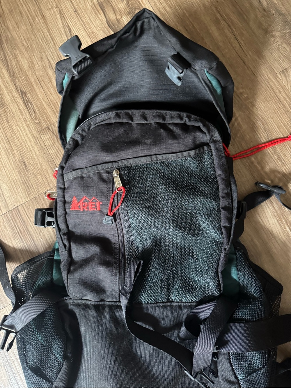 REI Black and Green Daypack with Red Logo Accents